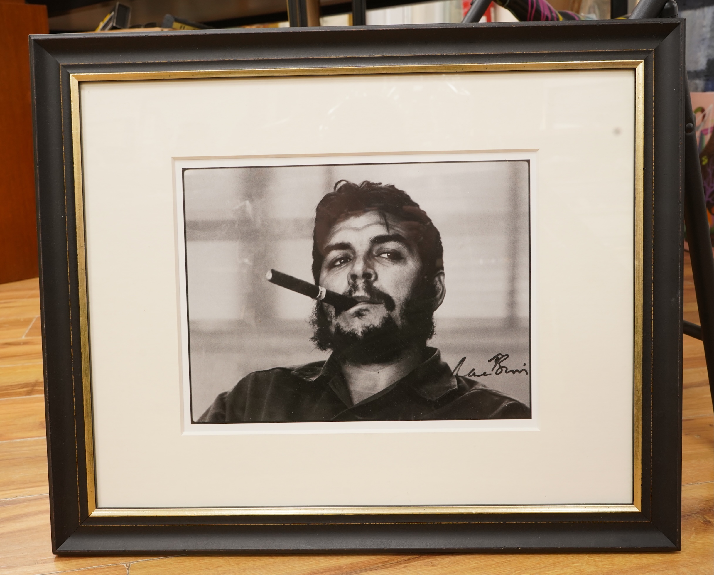After Rene Burri (1933-2014), ‘Che Guevara smoking a cigar’, facsimile signature, gelatin silver print, 25 x 32cm